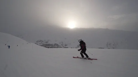 Young Skier man is Carving Down the Snowy Slope Wanderlust Stock Footage 84775994