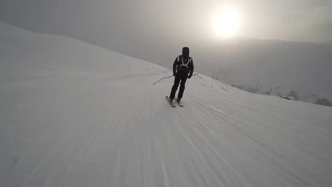 Young Skier man is Carving Down the Snowy Slope Wanderlust Stock Footage 84787613