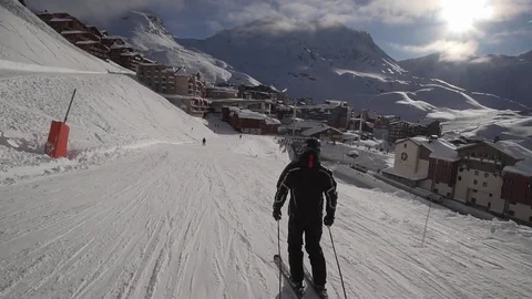 Young Skier man is Carving Down the Snowy Slope Wanderlust Stock Footage 84793679