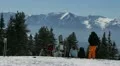 Young Skiers Resting Watching Enjoy Beautiful Panoramic Mountain Winter Scene HD Footage