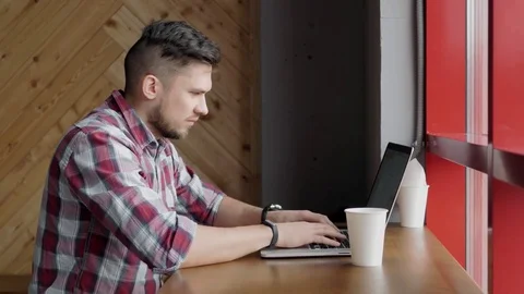 Young skilled male freelancer sleeping starting working day early in morning Stock Footage 75170201