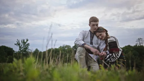 Young Slavic couple resting in field together Video stock 202067437