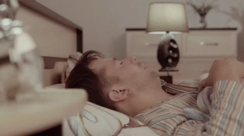 Young sleeping man having a nightmare Видео 68421361