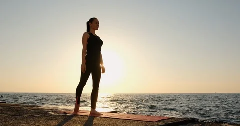 A young slender girl does an exercise  Stock Footage 123499353