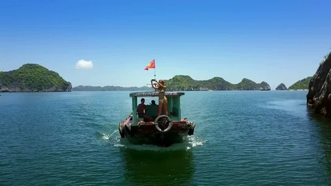 Young Slim Lady Makes Selfie on Boat Bow with Vietnamese Flag Stock Footage 83190539