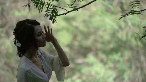 Young slim woman silhouette in a forest Stock Footage