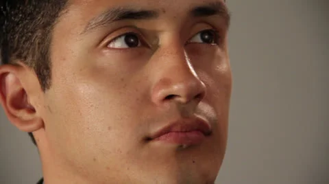 Young smart man sees something in left corner eyes and makes a broad smile Video stock 22825673