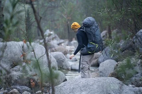 A young smiley man with a backpack . Stock Photos