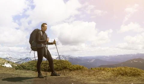 A young smiley man with a backpack Stock Photos