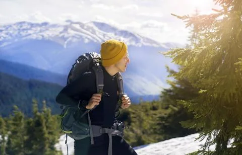 A young smiley man with a backpack . Stock Photos