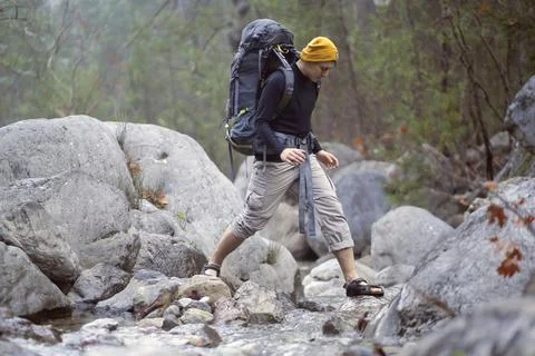 A young smiley man with a backpack Stock Photos