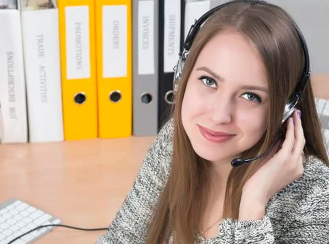 Young smiling customer support operator Stock Photos