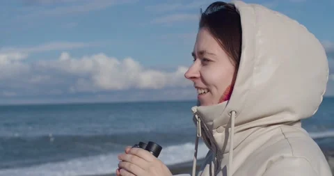 Young smiling female looking through binoculars at something interesting in sea Stock Footage 167876488