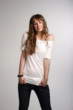 Young smiling girl posing in studio Stock Photos