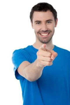 Young smiling guy pointing you out Stock Photos
