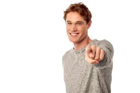 Young smiling guy pointing you out Stock Photos