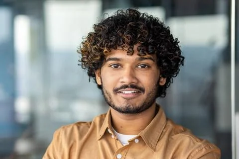 Young smiling indian programmer close up smiling and looking at camera, portrait Stock Photos