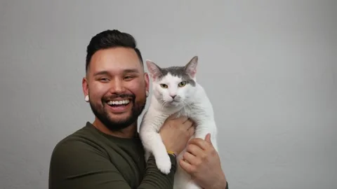 Young Smiling Man with Cat Stock Footage 173346993