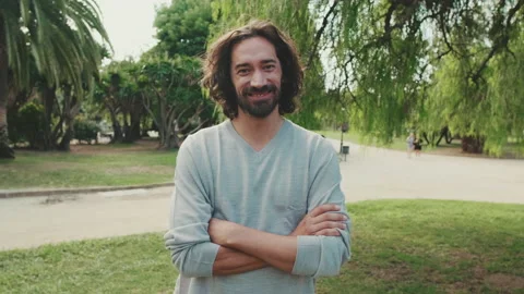 Young smiling man looking at camera Stock Footage 227140477