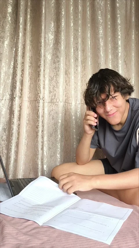 A young smiling man is talking on the phone Stock Footage 311653987