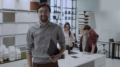 Young smiling office worker in design studio Stock Footage 84725961
