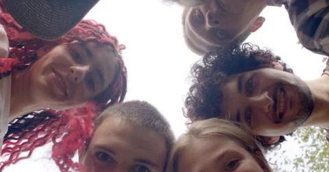 Young Smiling People looking into camera from top to bottom. Group therapy Stock Photos