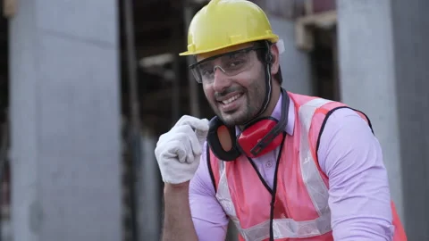 Young Smiling positive Indian engineer looking at camera and smiling. 動画素材 161876676