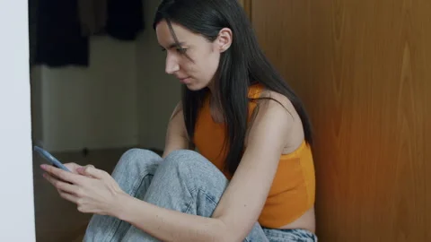 Young Smiling Woman Using Mobile Phone At Home. Stock Footage 220725219