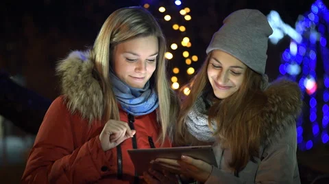Young smiling women having enjoyable time with tab Stock Footage 59163704