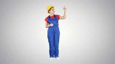 Young smiling Worker woman presenter pushing imaginary buttons f Stock Photos