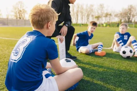 Young Soccer Trainer Coach Explaining Tactic on Team Sports Tactics Board Stock Photos