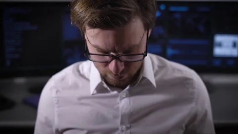 Young software developer for mobile devices is testing a new program on a small Stock Footage 72448694