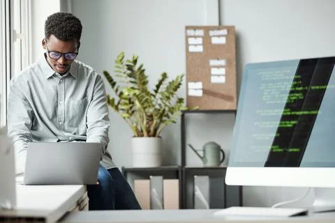 Young Software Developer in Office Stock Photos