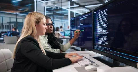 Young Software Developers Work Together, Coding Secure Programs Online. Stock Photos