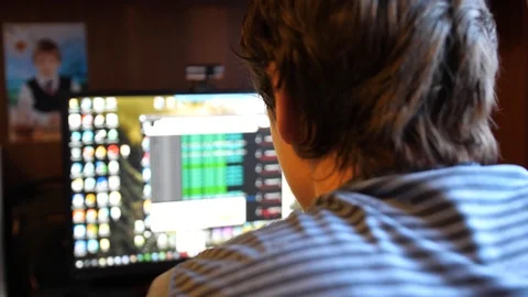 A young software engineer guy works in his office on a computer. Writes code for Video stock 88539152