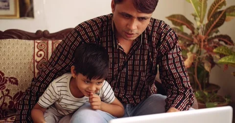Young son child using technology devices along with parents in lockdown Stock Footage 145705830