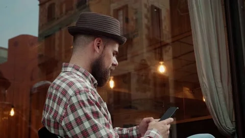 Young Spanish man using phone close-up, texting message or surfing the internet Video stock 173234445