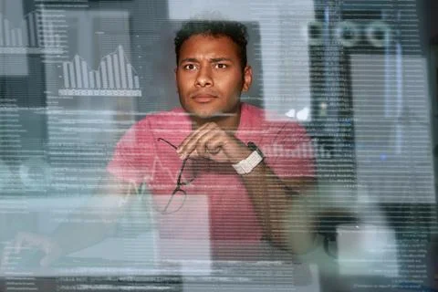 Young spectacled concentrated indian data analyst using big data Stock Photos