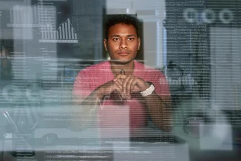 Young spectacled concentrated indian data analyst using big data Stock Photos