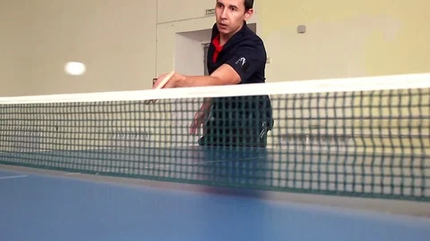 Young sports man table tennis player in play on old gym. Action shot. Stock Footage