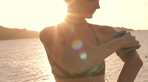 Young sports woman walk on the beach Stock Footage
