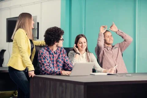 Young start up team disccusing projects Stock Photos