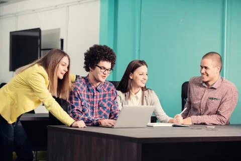 Young start up team disccusing projects Stock Photos