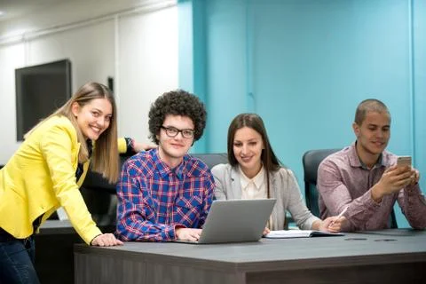 Young start up team disccusing projects Stock Photos
