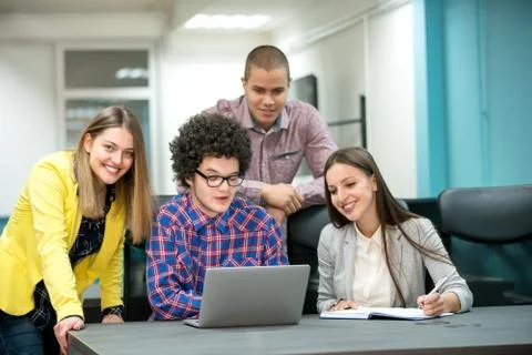 Young start up team disccusing projects Stock Photos