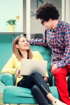 Young start up team disccusing projects Stock Photos