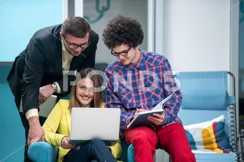 Young start up team disccusing projects Stock Photos