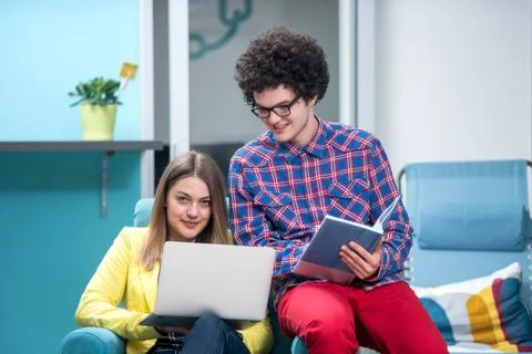 Young start up team disccusing projects Stock Photos