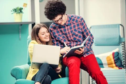 Young start up team disccusing projects Stock Photos