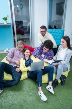 Young start up team disccusing projects Stock Photos